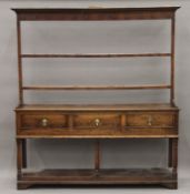 An 18th century oak dresser. 179 cm wide.