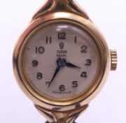 A ladies Tudor Royal 9 ct gold wristwatch. 2 cm wide. 10.9 grammes total weight.