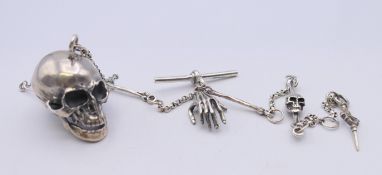 A silver skull and chain. The chain 30 cm long.