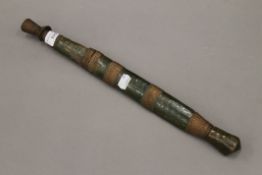 A copper bound tribal dagger in wooden sheath. 44.5 cm long.