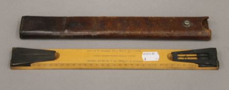 A Boxwood Range Finder Sigent rule by J Hicks London in leather case. 31.5 cm long.