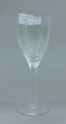 A Lalique France wine glass decorated with an angel. 20.5 cm high.