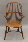A 19th century elm and yew wood Windsor chair. 56 cm wide.