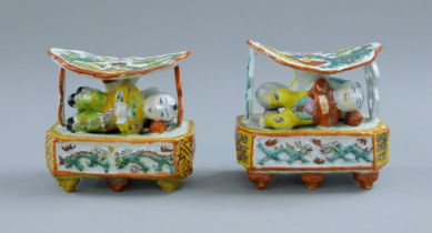 A pair of Chinese porcelain pillows. 14 cm high.