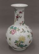 A Chinese Republic period floral porcelain bottle vase (base drilled for a lamp). 28 cm high.