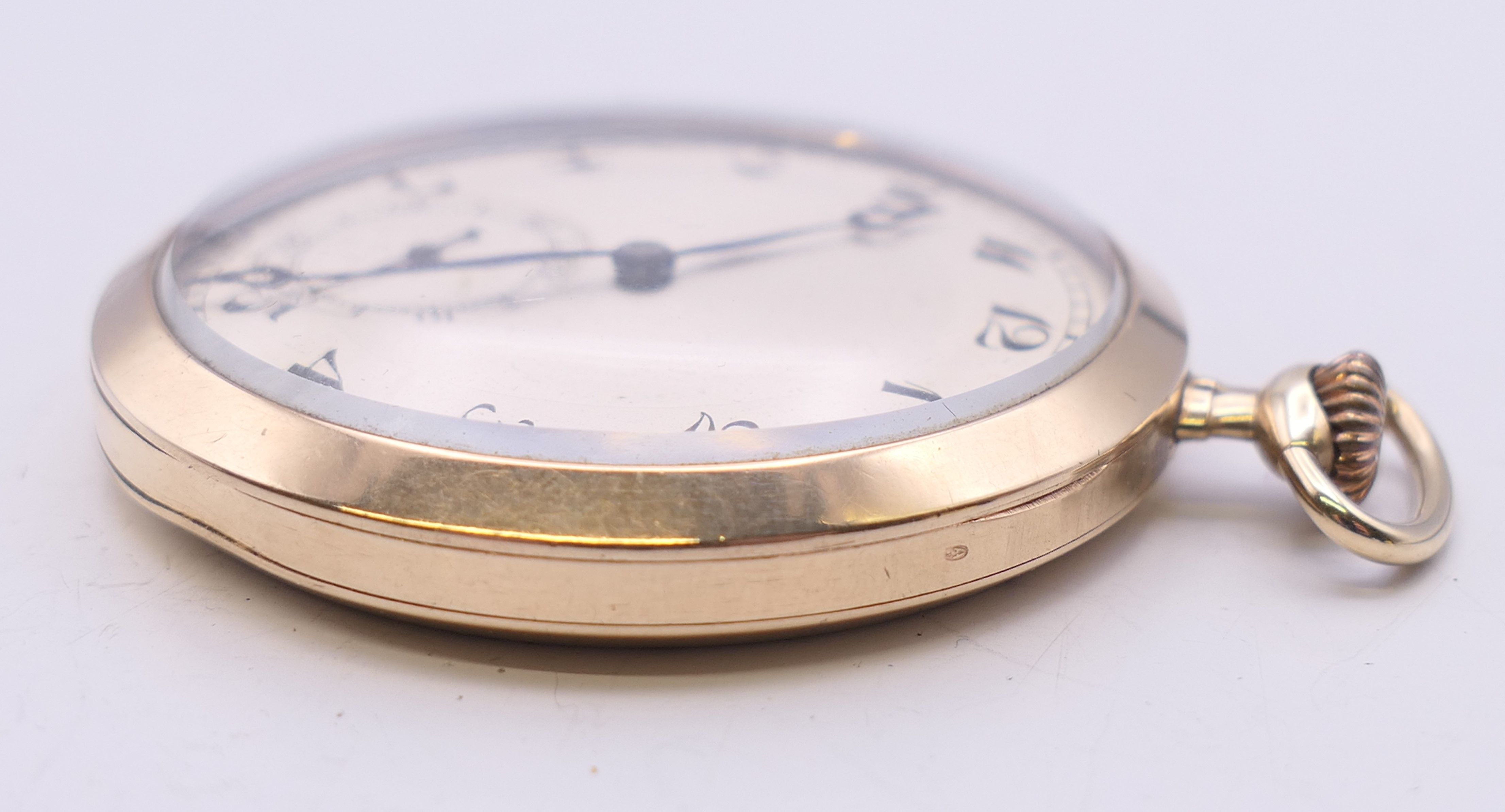 A 9 ct gold cased Dennison pocket watch, hallmarked for Birmingham 1951. 4.5 cm diameter. 49. - Image 5 of 7