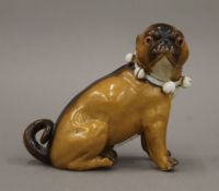 A 19th century pug dog, stamped Possneck Conta & Boehme. 10.5 cm high.