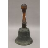 A large Victorian hand bell. 34 cm high.