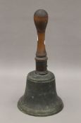 A large Victorian hand bell. 34 cm high.