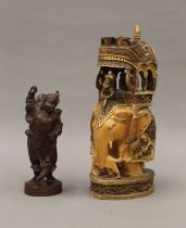 A Chinese carving and an Indian carving. The latter 27.5 cm high.