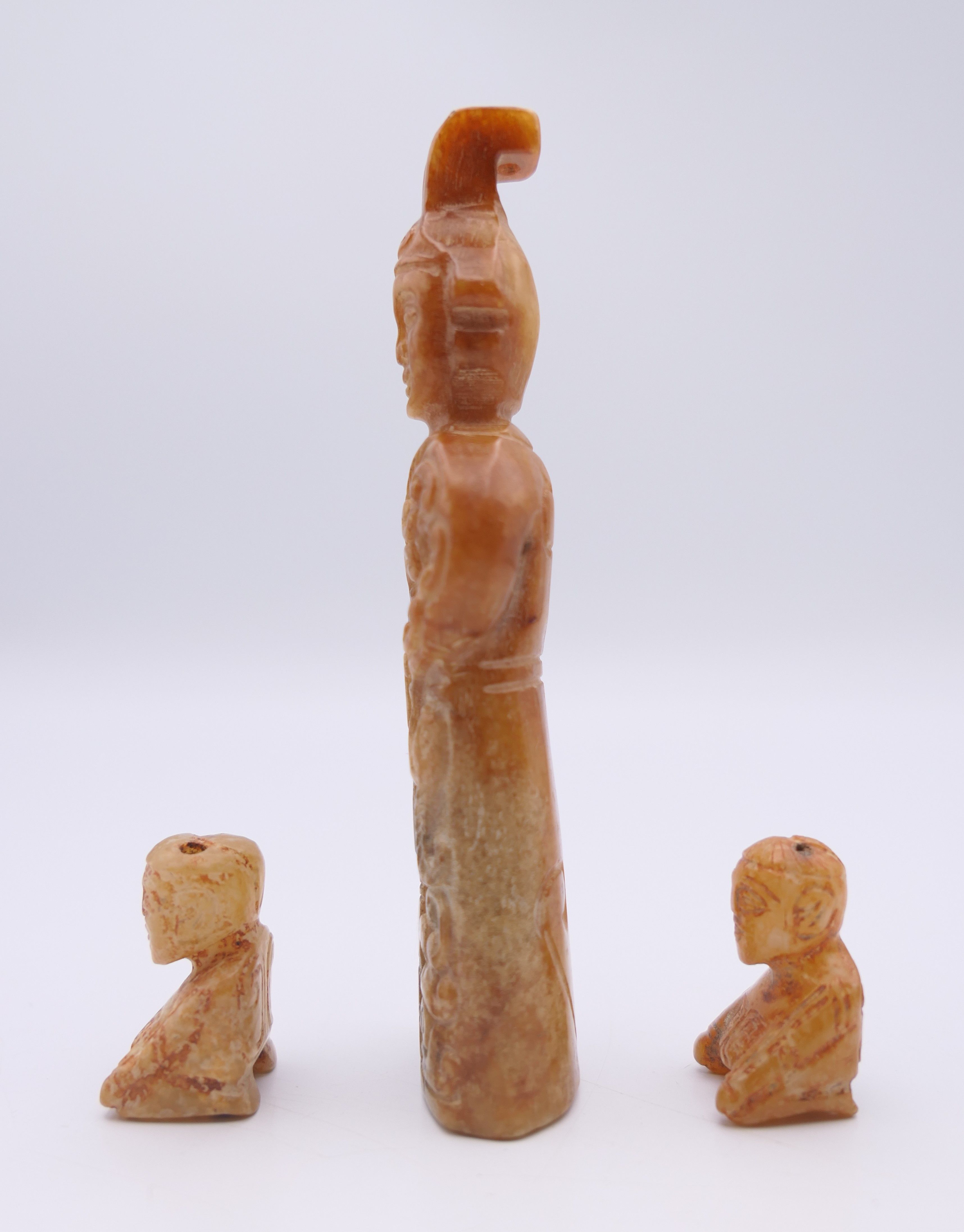 A Chinese jade standing male figure, together with two smaller kneeling male figures, Han Dynasty. - Image 3 of 11