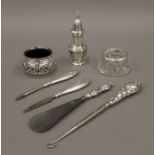 Seven silver and silver mounted items, comprising of a pepperette, two salts, a button hook,