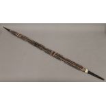 A painted Aboriginal spear. 105.5 cm long.