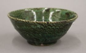 A Chinese green peacock feather bowl, Song Dynasty. 11 cm diameter.