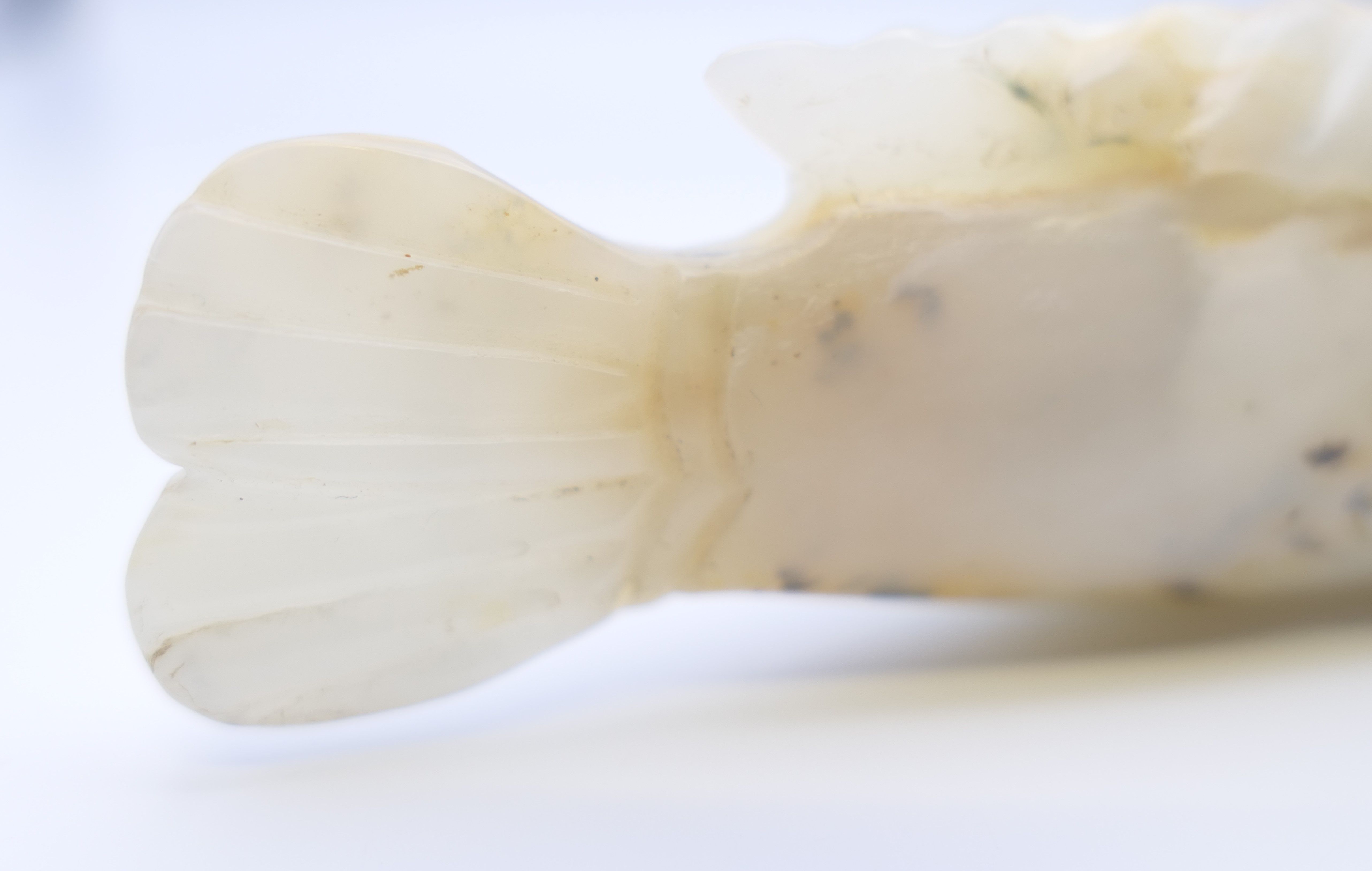 A small Chinese white jade fish, Yuan Dynasty. 12.5 cm long. - Image 8 of 8