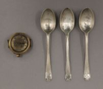 Three silver teaspoons and a gold cased wristwatch. The latter 3.5 cm wide.