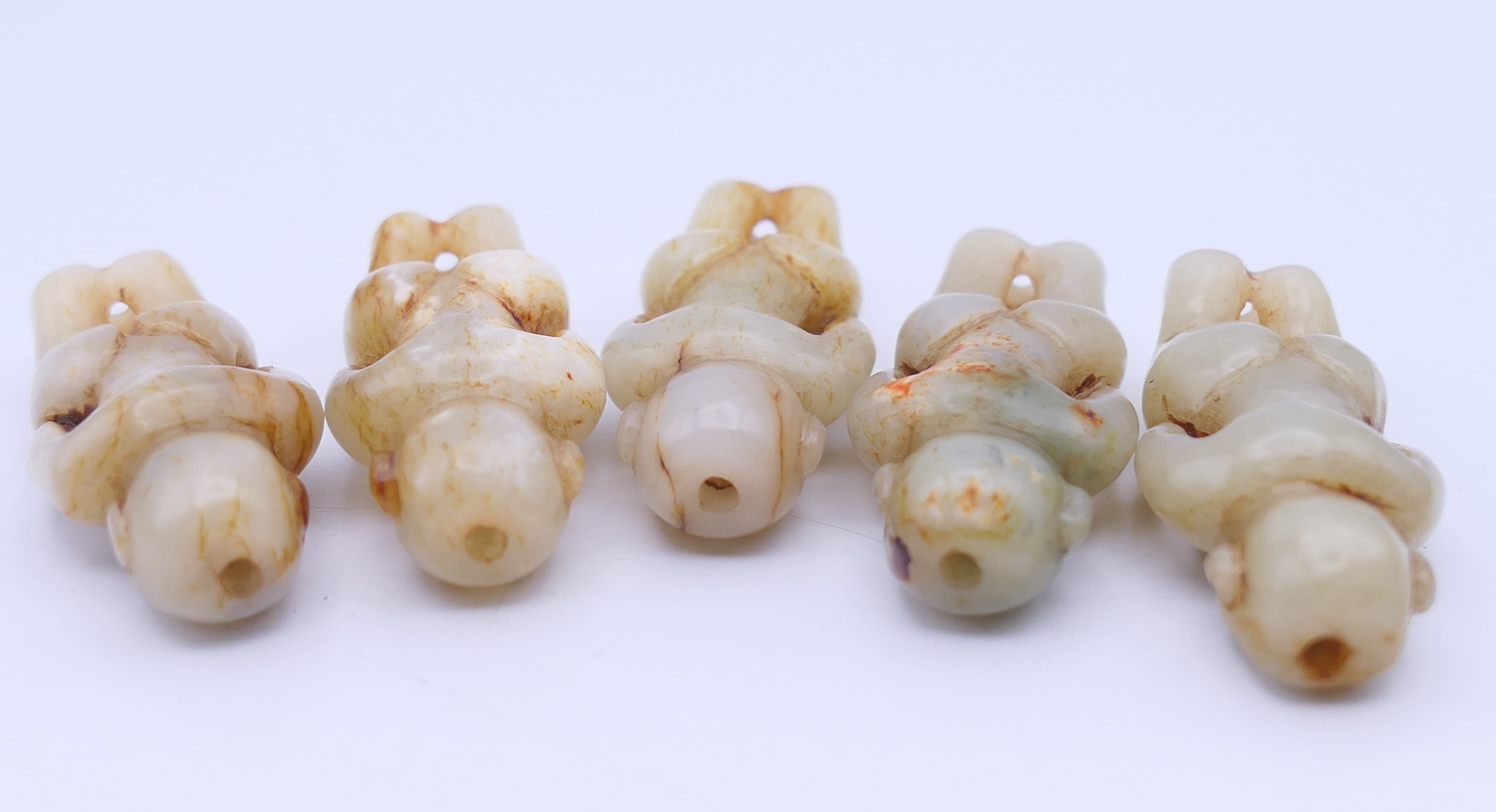 Nine Chinese fertility beads (seven male and two female), Han Dynasty. Each approximately 4 cm high. - Image 10 of 17