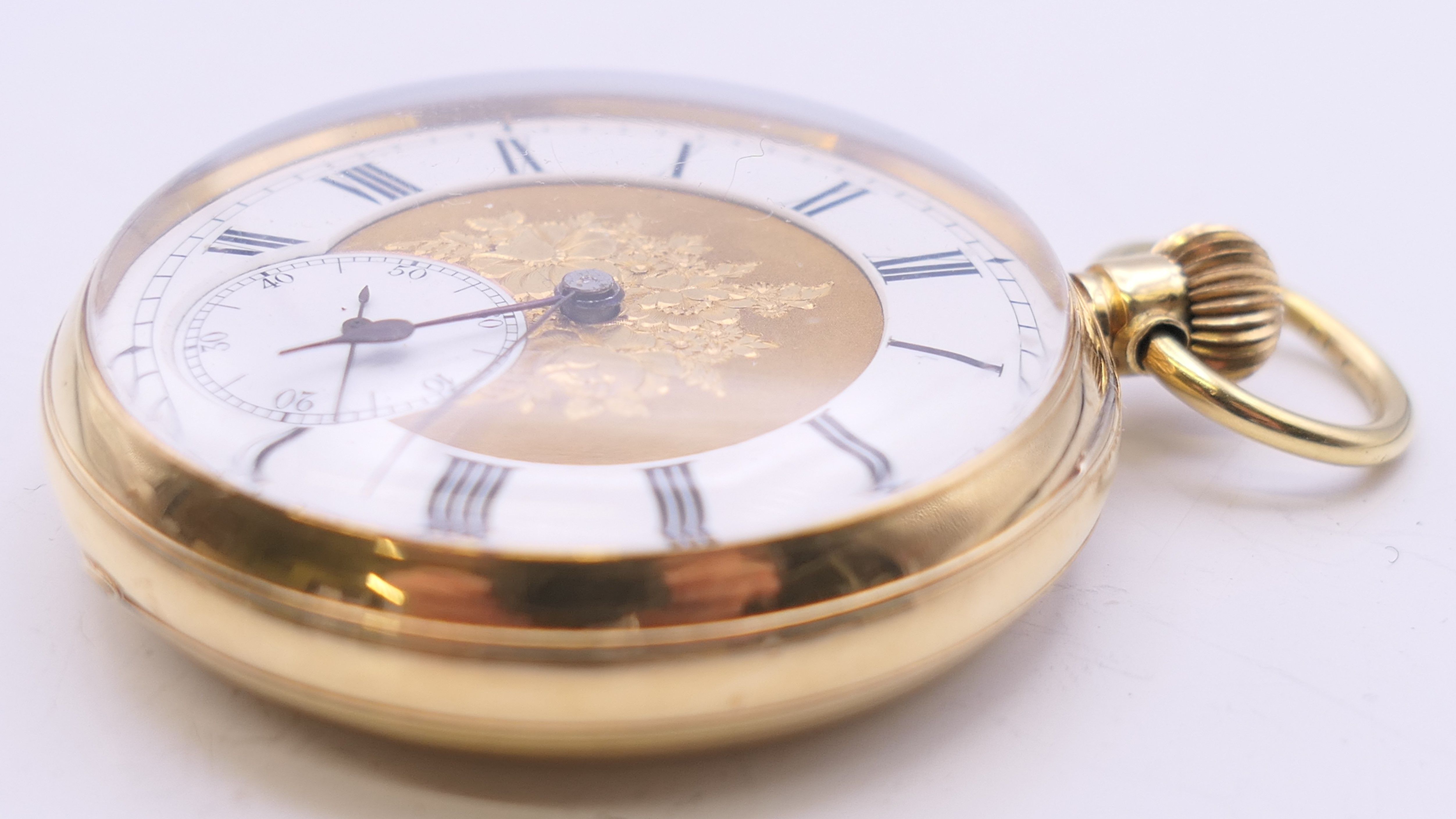 An 18 ct gold pocket watch with florally engraved dial, serial number 15514. 4.25 diameter. - Image 4 of 8