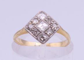 An Art Deco unmarked gold diamond set ring. Ring size I. 2.1 grammes total weight.