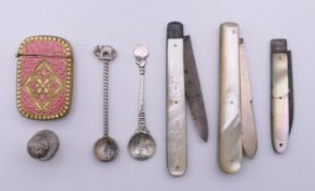 Three silver bladed mother-of-pearl fruit knives, an enamelled decorated brass vesta, etc.