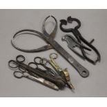 A collection of tools, including sugar snips, wick trimmers, blacksmith callipers, etc.