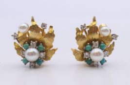 A pair of 18 ct gold turquoise, pearl and diamond earrings. 2 cm high. 11.8 grammes total weight.