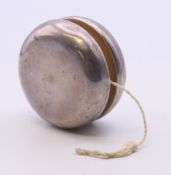 A Tiffany & Co silver clad yo-yo. 5.75 cm diameter.