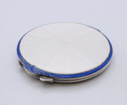 An enamel decorated silver compact, hallmarked for Birmingham 1949. 7.5 cm diameter.