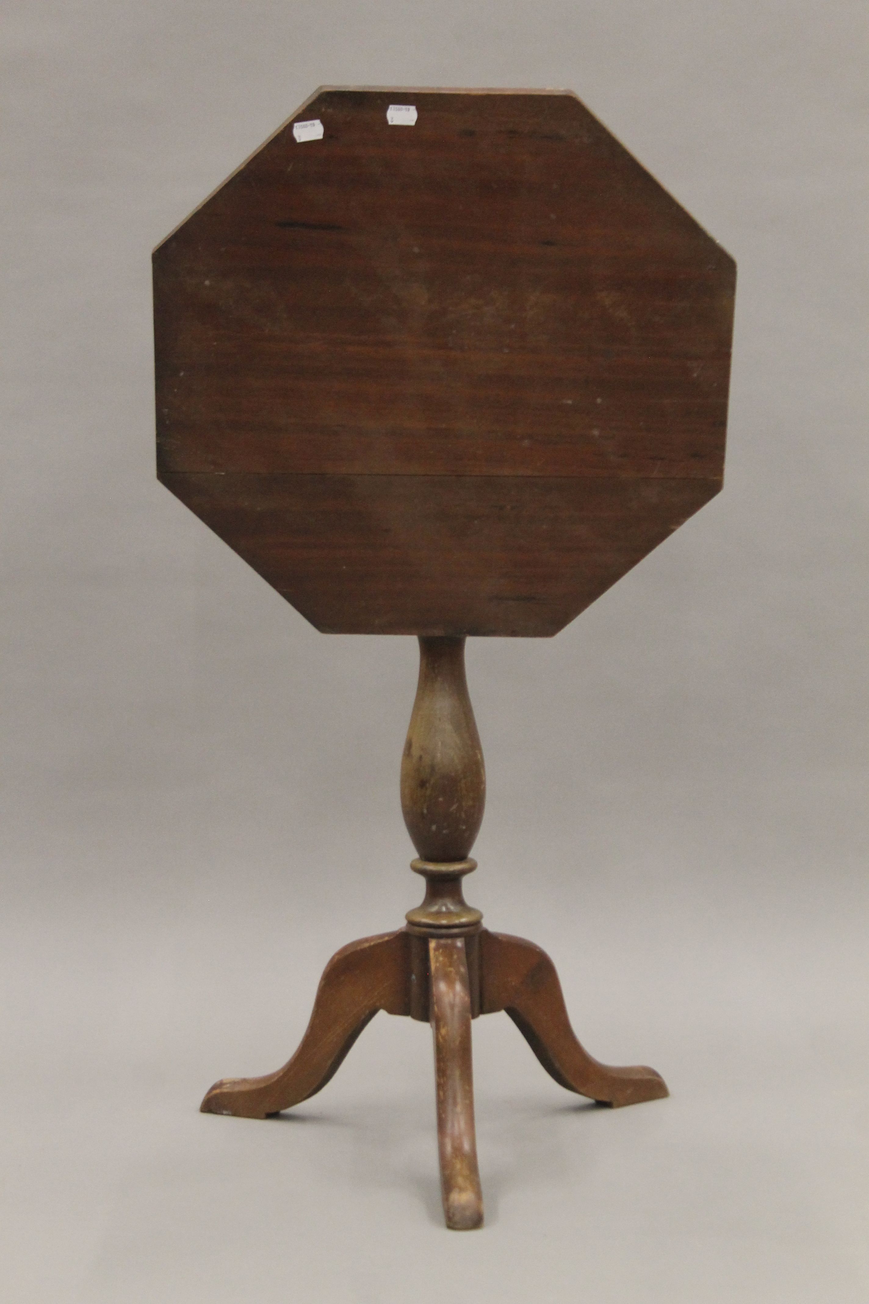 A 19th century octagonal tilt top tripod table. 51.5 cm wide.