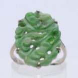 An unmarked 9 ct white gold and jade ring. Ring size M/N. 2.9 grammes total weight.
