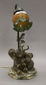 A table lamp decorated with elephants. 41 cm high.