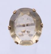 A large 18 ct gold citrine ring. Ring size Q. 7.7 grammes total weight.