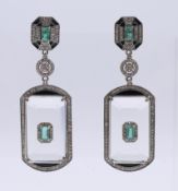 A pair of diamond, emerald and rock crystal Art Deco style earrings. 6 cm high.