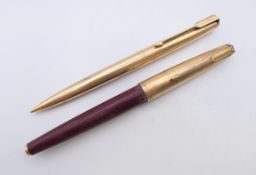 A Parker pen and a Parker pencil. The former 13 cm long.