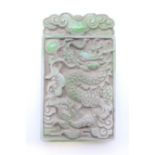 A carved jade tablet. 9 cm x 5 cm.