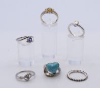 Six silver gem/stone set rings.