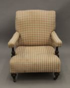 A Victorian upholstered open armchair. 69 cm wide.