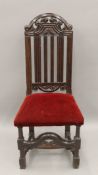 An 18th century oak splat back side chair. 48 cm wide.