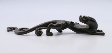 A bronze dog-of-fo scroll weight. 16 cm long.