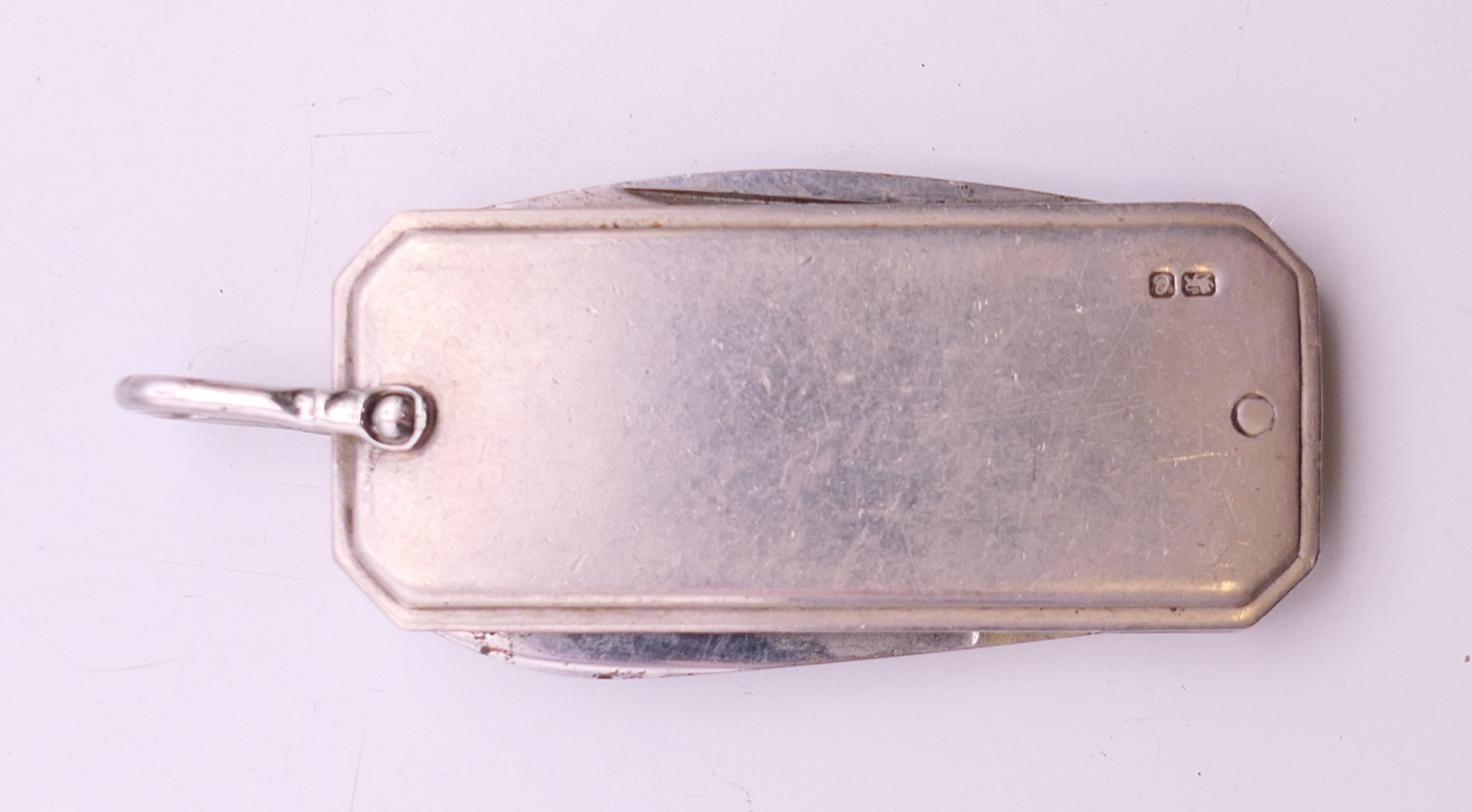 A silver cased penknife. 4.5 cm x 2 cm. 26 grammes total weight. - Image 2 of 4