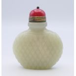 A Chinese white jade diamond cut pattern snuff bottle, with red stopper, Qing Dynasty.