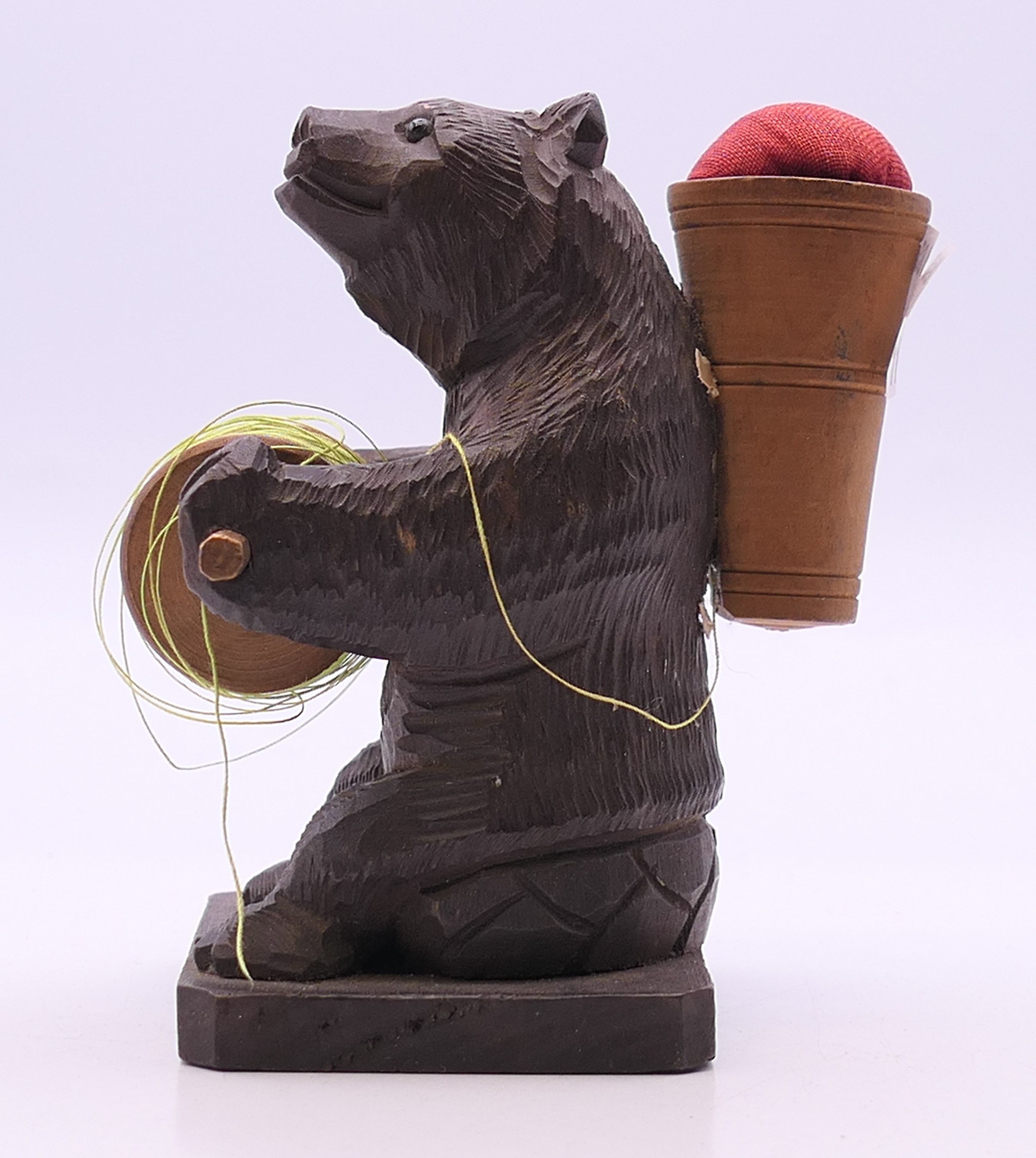 A Blackforest cotton reel holder and pin cushion formed as a bear. 9 cm high. - Image 3 of 3