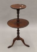 An early 20th century two tier mahogany side table. 76.5 cm wide.