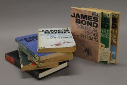 A quantity of Ian Fleming 007 books, including a hardback.