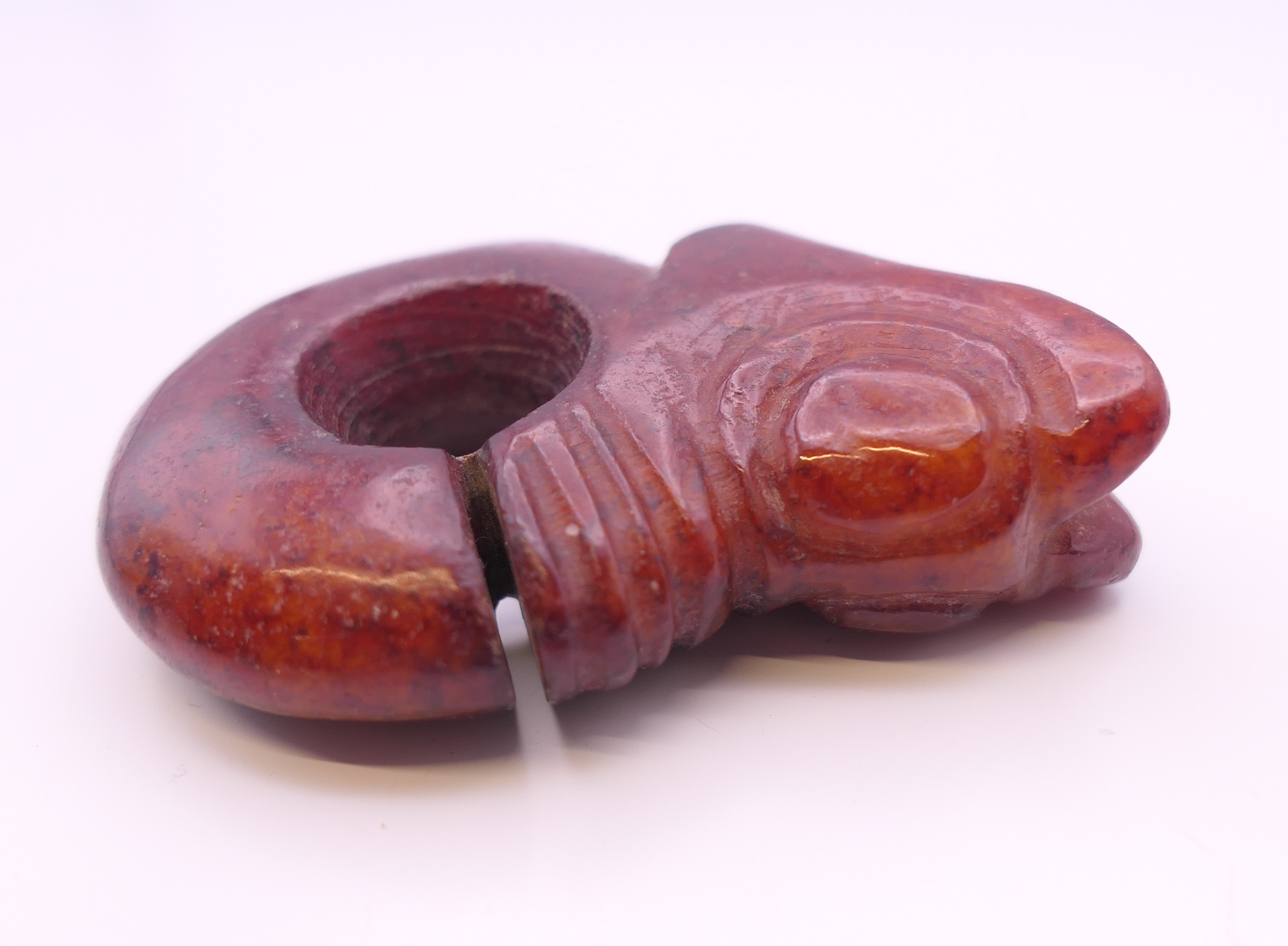 A Chinese red jade pig dragon, early Hongshan Culture. 6 cm long. - Image 4 of 6