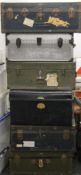 A quantity of travelling trunks, including military examples. The largest 91 cm wide.