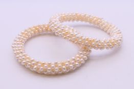 Two seed pearl bangles. 5.5 cm internal diameter.