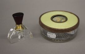 A boxed glass scent bottle and a powder box. The latter 11.5 cm diameter.