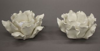A pair of late Victorian floral patterned porcelain candle holders. 7.5 cm high.