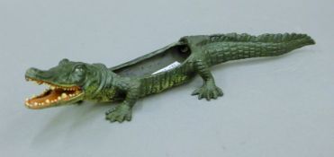 A cold painted bronze model of a crocodile. 22 cm long.
